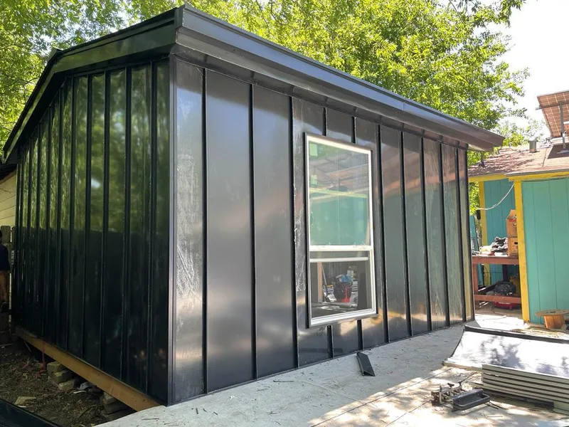 Black standing seam metal wall panels for Roof Inspection in Prien