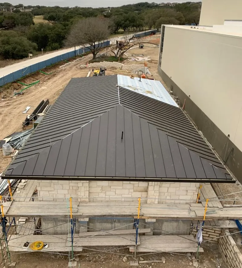 Metal roof new construction with scaffolding in Prien